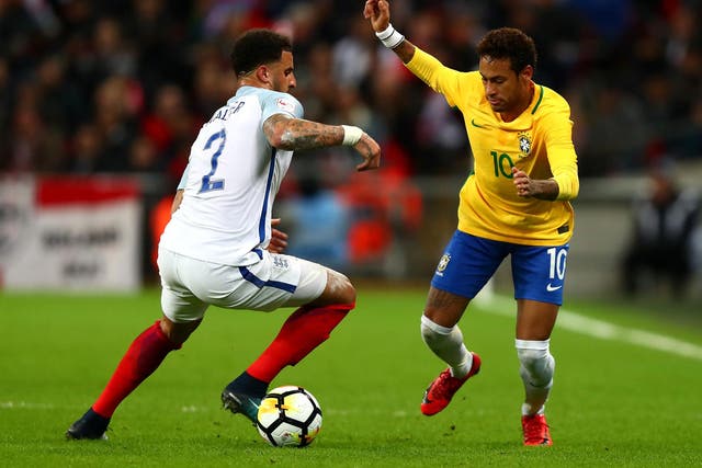 Neymar, right, takes on England wing-back Kyle Walker 