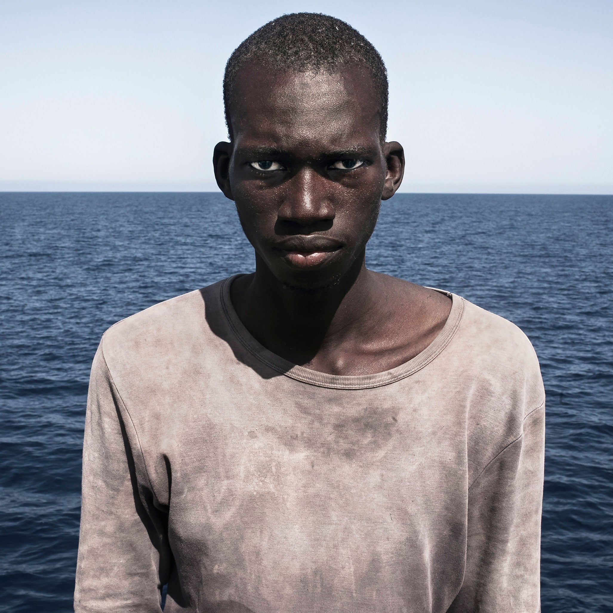 The photo was taken just moments after he was rescued from the Mediterranean Sea