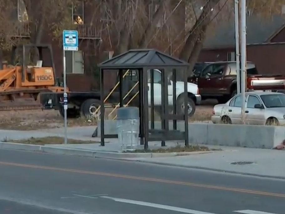 The bus stop where the jogger ran to after he was stabbed