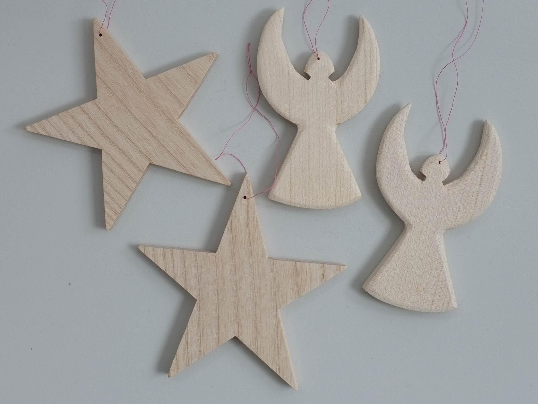 These Scandi wooden decorations are handmade by a team at The Grange, a residential community for people with learning disabilities, £9.95 Aerende.co.uk