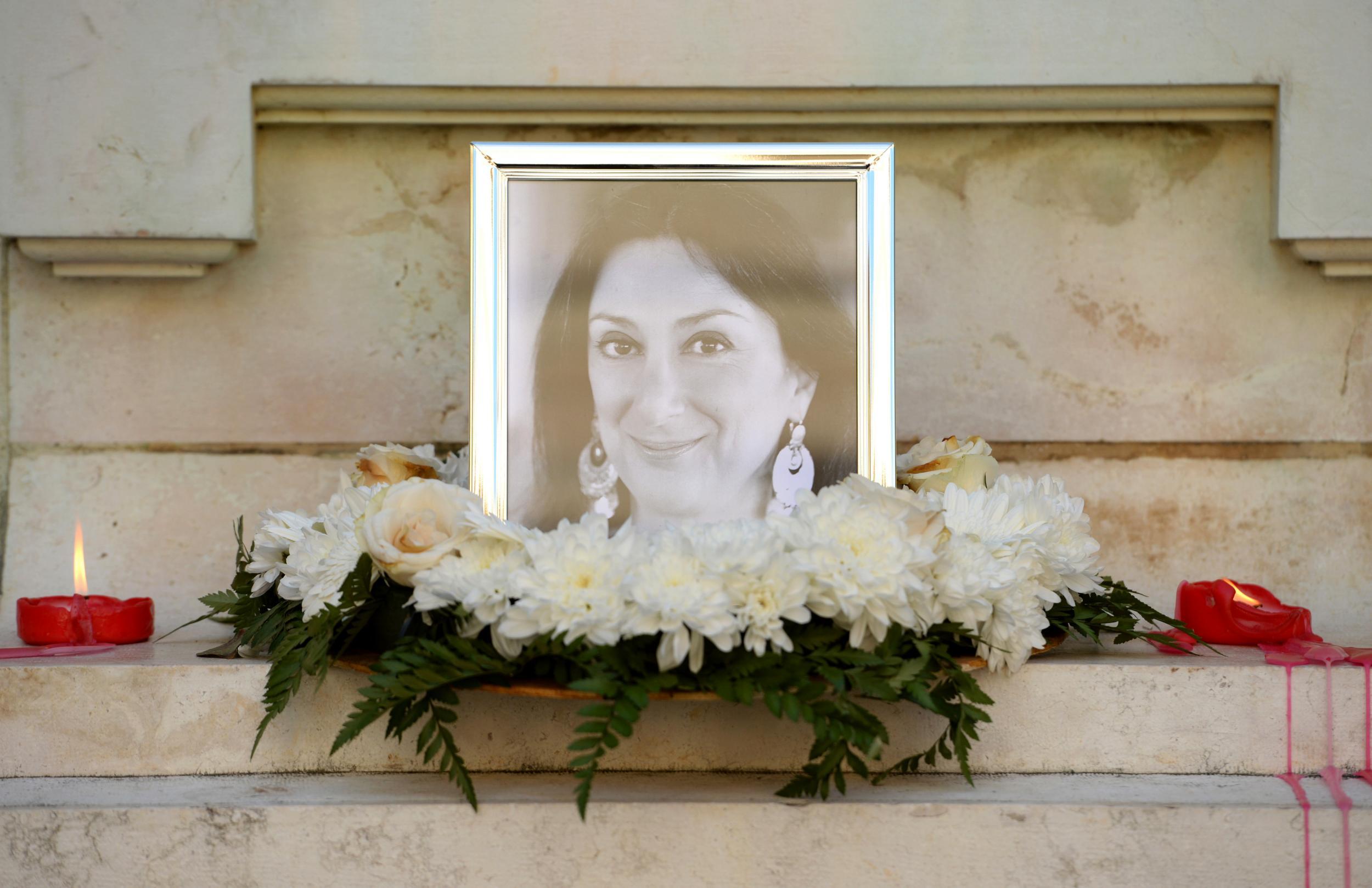 Flowers and tributes at a shrine for Caruana Galizia