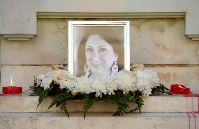 Flowers and tributes at a shrine for Maltese journalist and blogger Daphne Caruana Galizia who was killed by a car bomb outside her home in October, spurring questions about rule of law in Malta