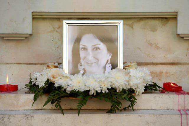 Flowers and tributes at a shrine for Maltese journalist and blogger Daphne Caruana Galizia who was killed by a car bomb outside her home in October, spurring questions about rule of law in Malta