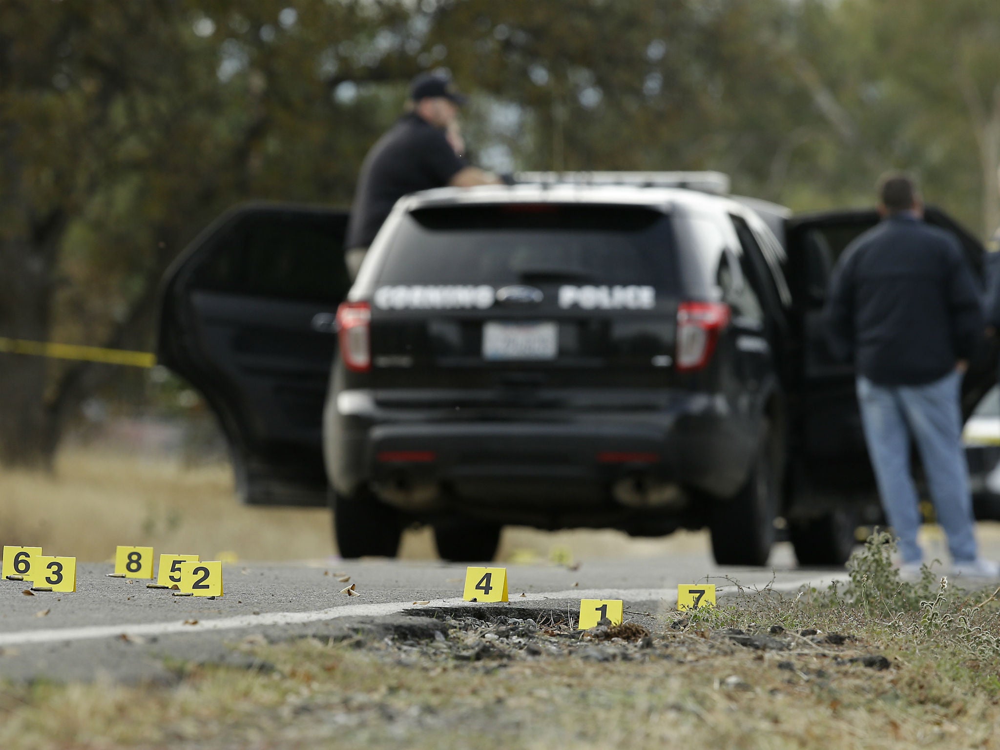 Yellow tags mark where bullet casings found at one of the scenes of the shooting spree at Rancho Tehama Reserve, on Tuesday, Nov. 14, 2017.