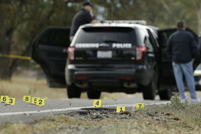 Yellow tags mark where bullet casings found at one of the scenes of the shooting spree at Rancho Tehama Reserve, on Tuesday, Nov. 14, 2017.