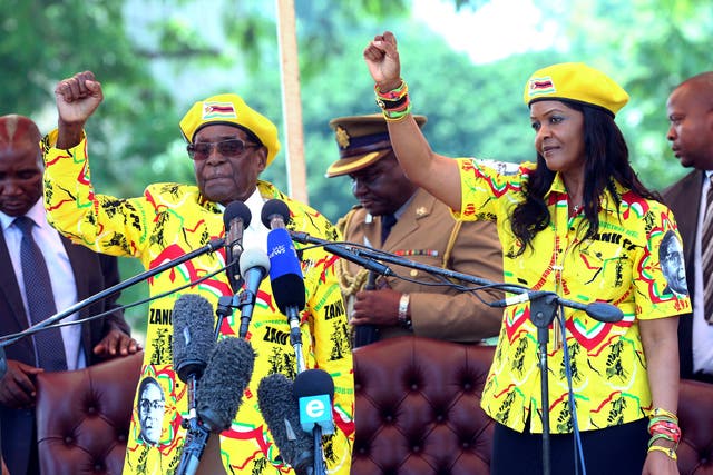 Zimbabwe's President Robert Mugabe, left, and his wife Grace Mugabe