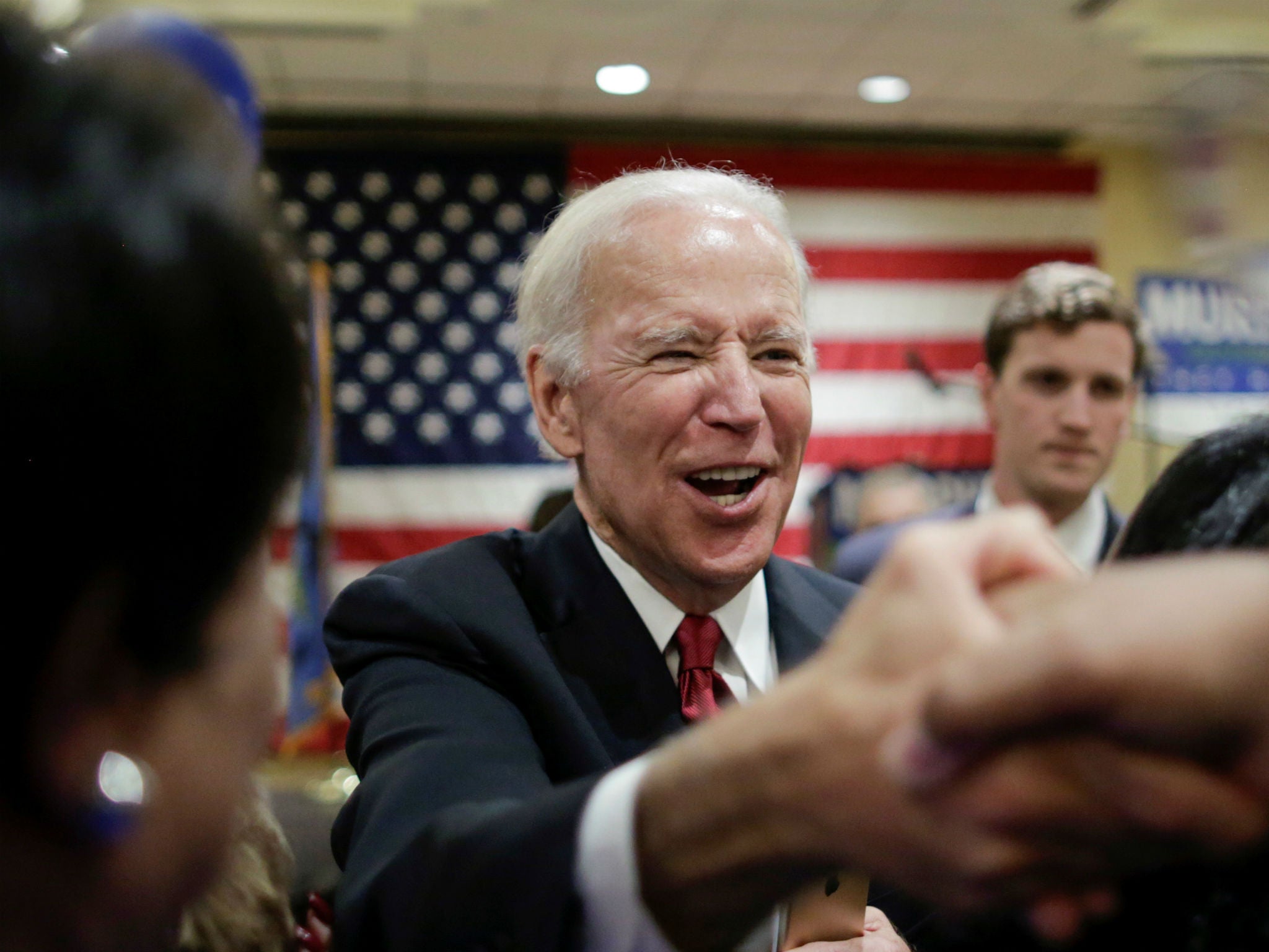 Joe Biden greets attendees at the end of a political rally in Newark, New Jersey on October 12, 2017.