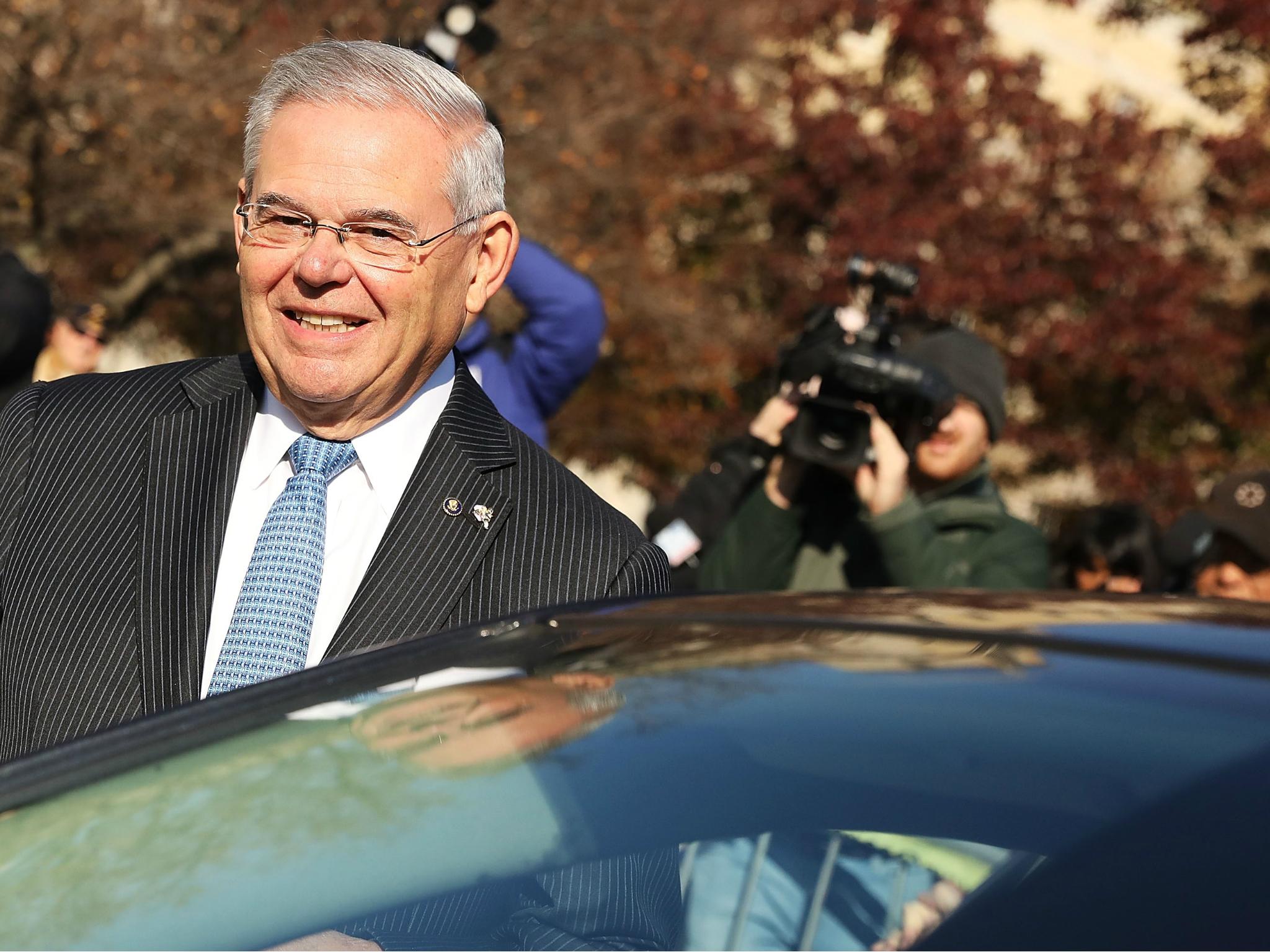 Robert 'Bob' Menendez gets into his car as he departs federal court, 15 November 2017 in Newark, New Jersey, where a mistrial was just declared