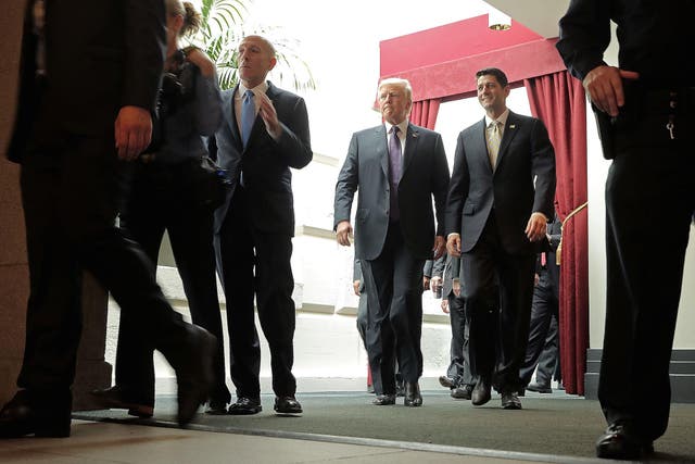 President Donald Trump and Speaker of the House Paul Ryan leave a House Republican conference meeting (Photo by Chip Somodevilla/Getty Images)