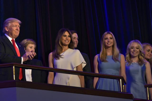 President Donald Trump applauds next to his soon Barron, his wife Melania, son-in-law Jared Kushner, and daughters Ivanka and Tiffany during election night on 9 November 2016.
