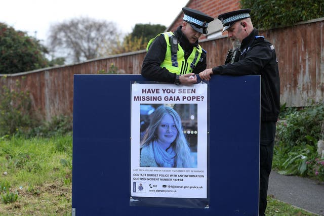 Police put up a missing person notice for Gaia Pope in Swanage, Dorset