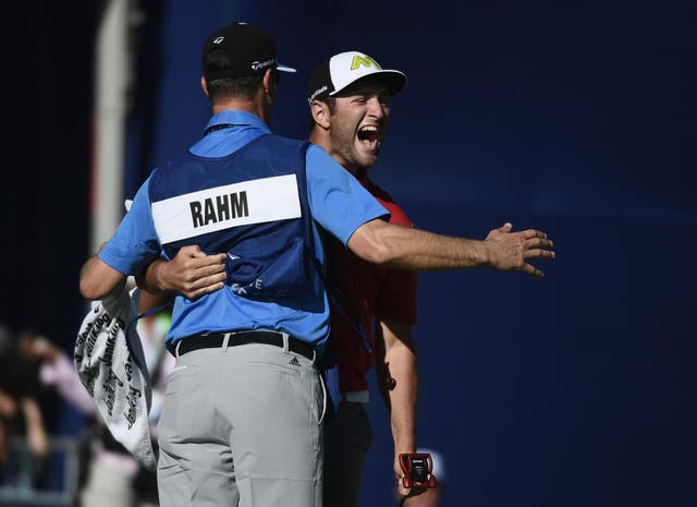 Jon Rahm celebrates his eagle to win the Farmers Insurance Open