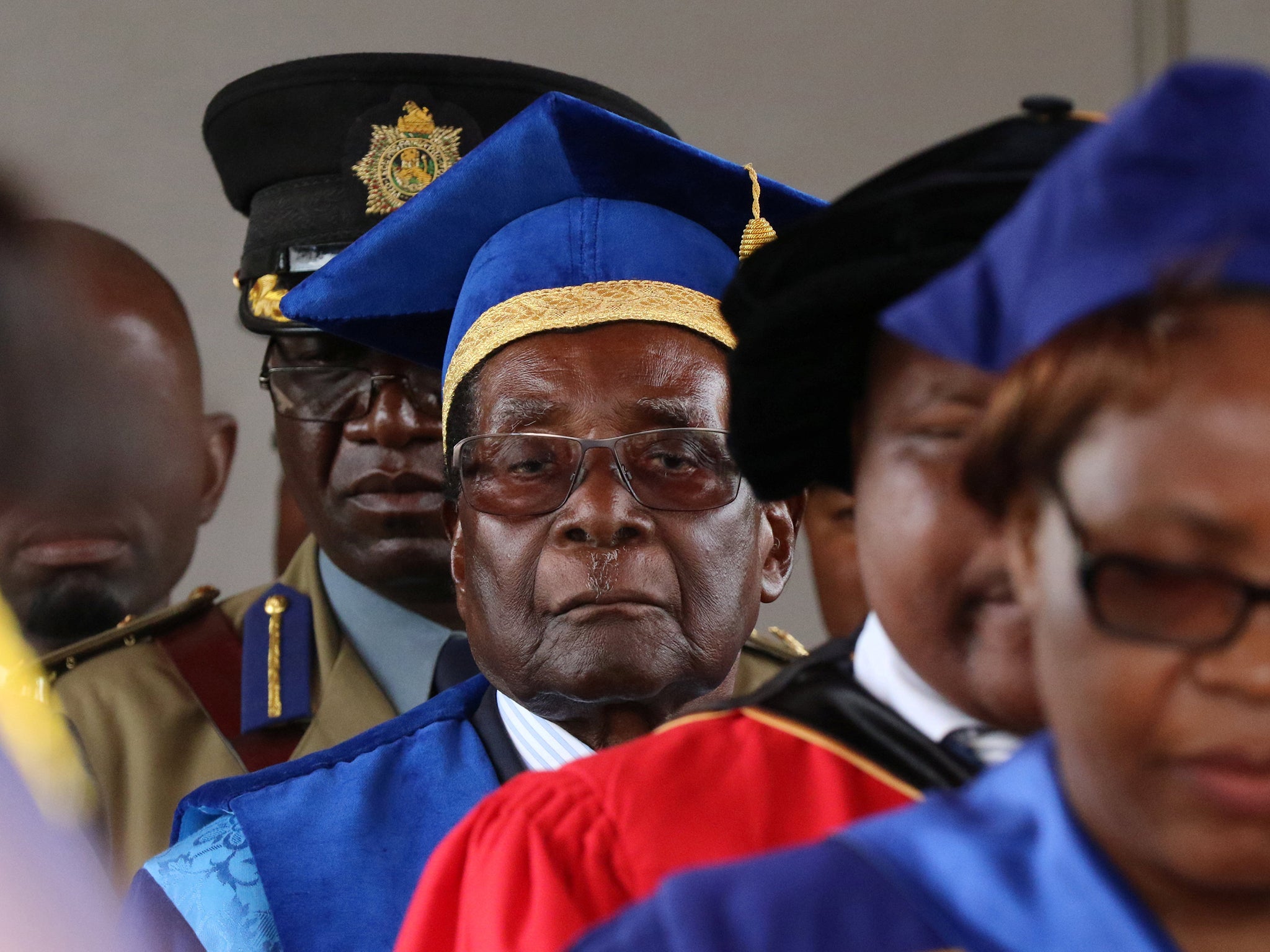 Robert Mugabe attended a university graduation ceremony in Harare while under house arrest (Reuters)