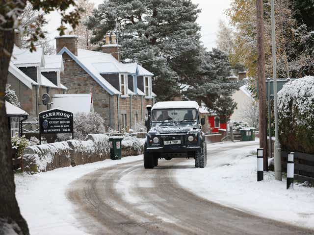 A 4x4 on roads in the village of Carrbirdge in the Scottish Highlands where snow fell last week