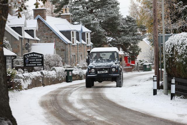 A 4x4 on roads in the village of Carrbirdge in the Scottish Highlands where snow fell last week
