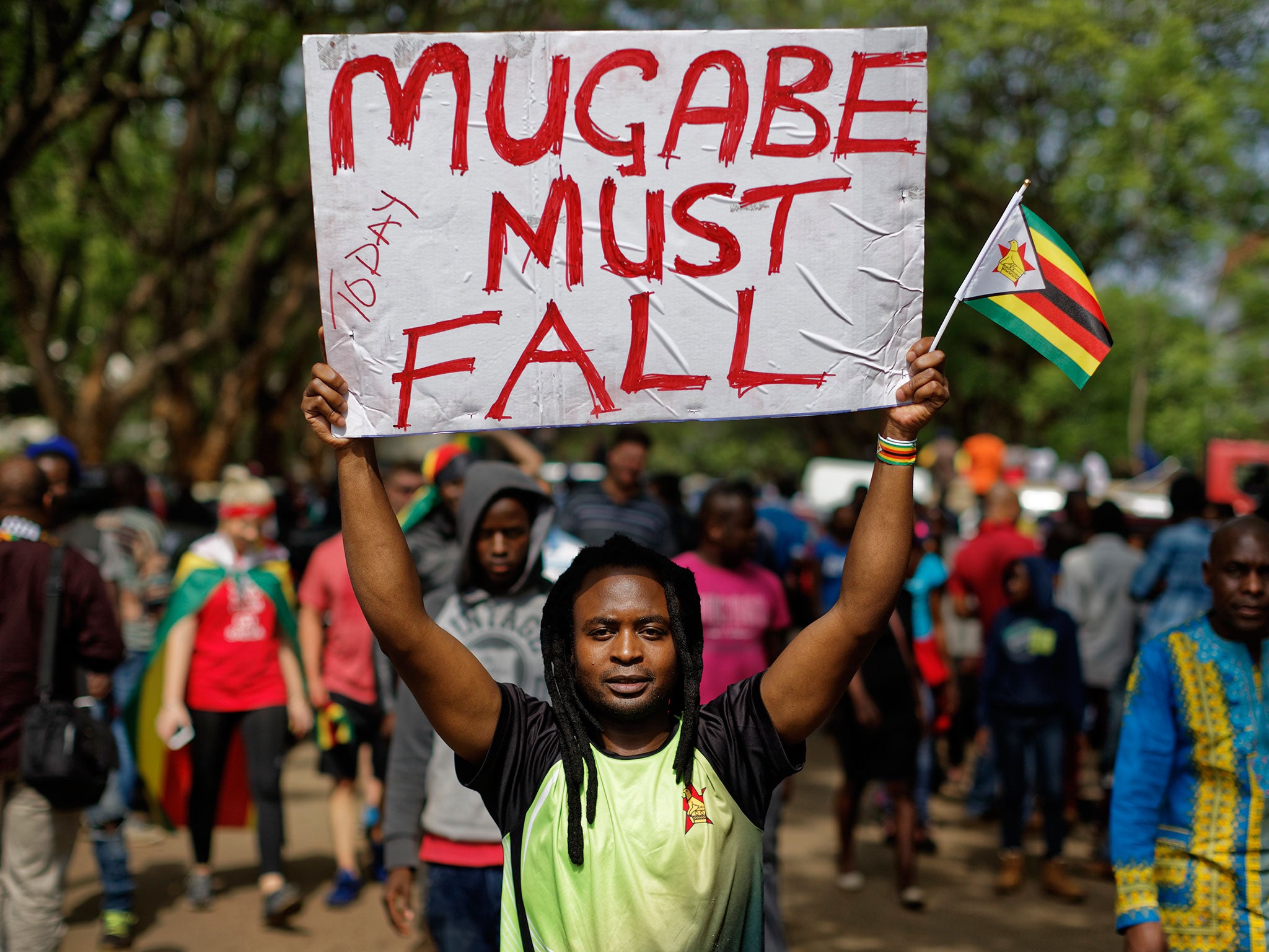 Protesters demanding President Robert Mugabe stands down march towards State House in Harare