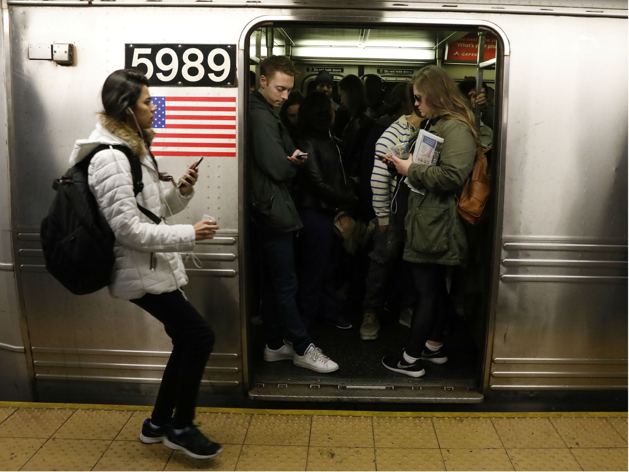 Passengers wait inside a subway train in New York City on April 21, 2017