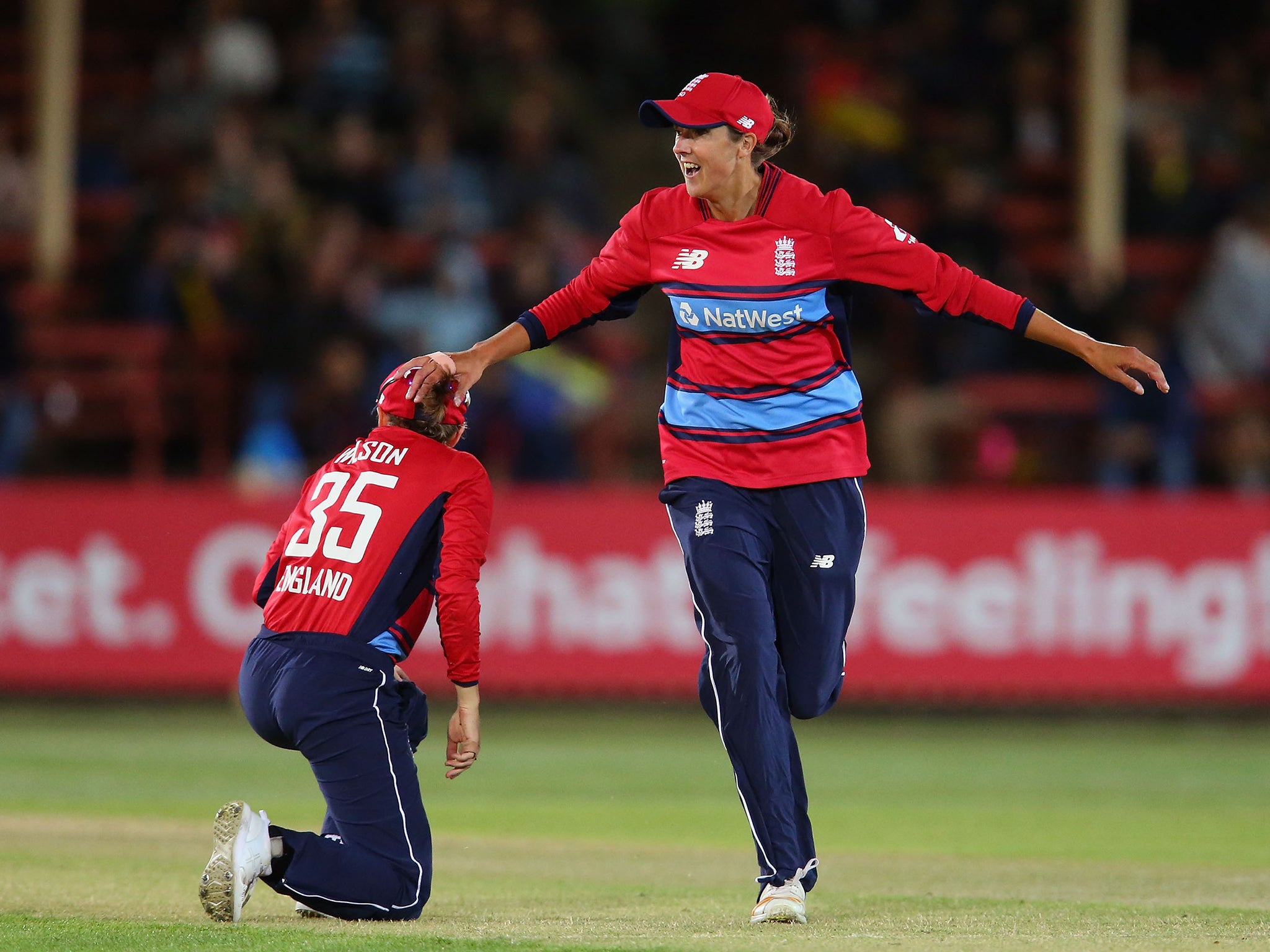 Gunn celebrates with Fran Wilson after taking a wicket