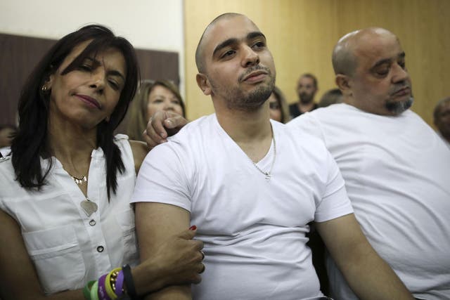 Azaria in court in July with his mother Oshra – civil rights campaigners claim his sentence is less than Palestnian children get for throwing stones