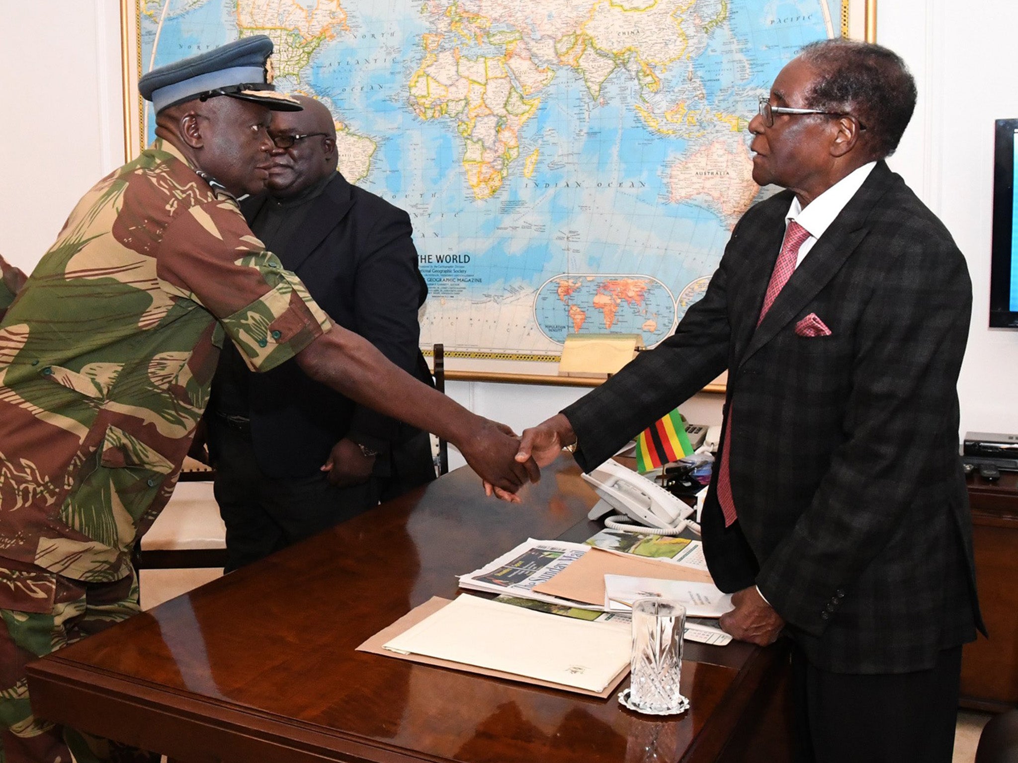 Robert Mugabe greeting the Air Force of Zimbabwe Commander Perence Shiri