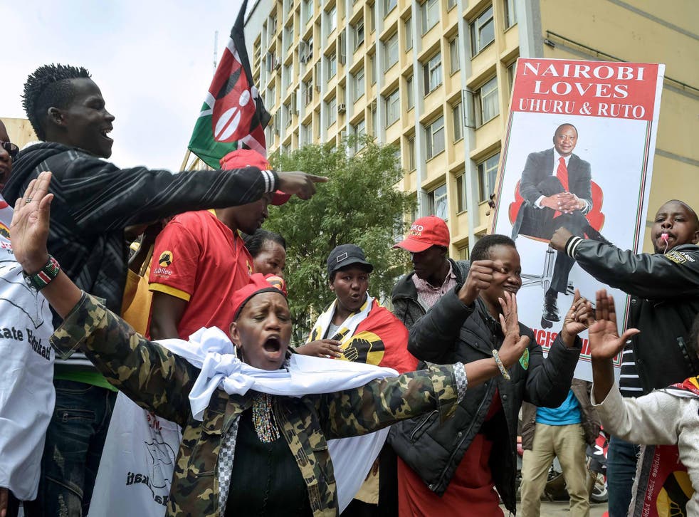 Supporters of President Uhuru Kenyatta celebrate in Nairobi after two petitions to overturn the election results were dismissed