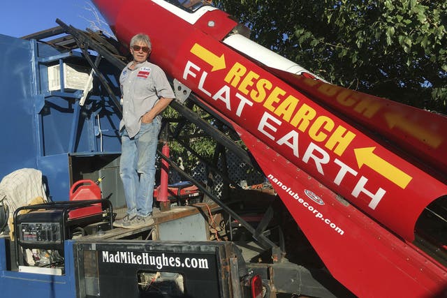 In this Wednesday, Nov. 15, 2017, photograph Mike Hughes is shown with with his steam-powered rocket constructed out of salvage parts on a five-acre property that he leases in Apple Valley, California