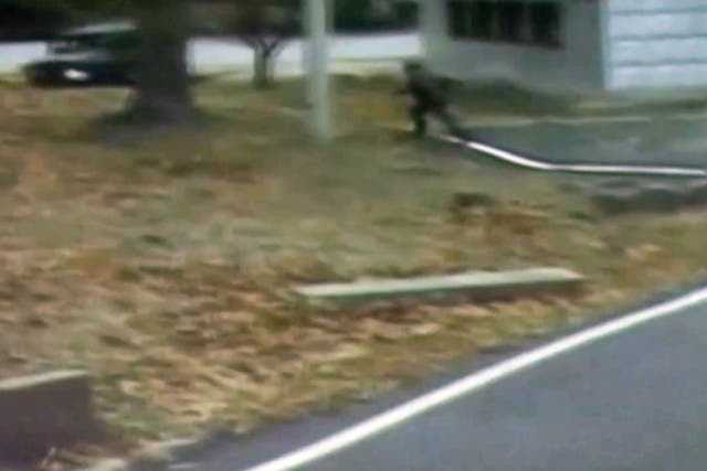 CCTV footage shows a North Korean soldier crossing the white Military Demarcation Line as he flees to the South
