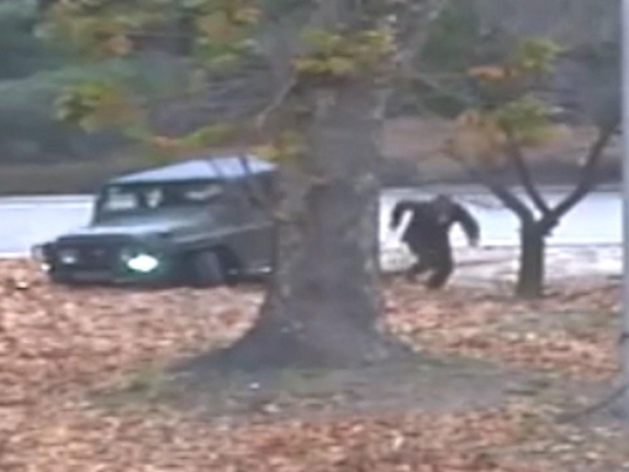A screen-grab shows the defector running out from a jeep at the Joint Security Area of the Korean Demilitarized Zone