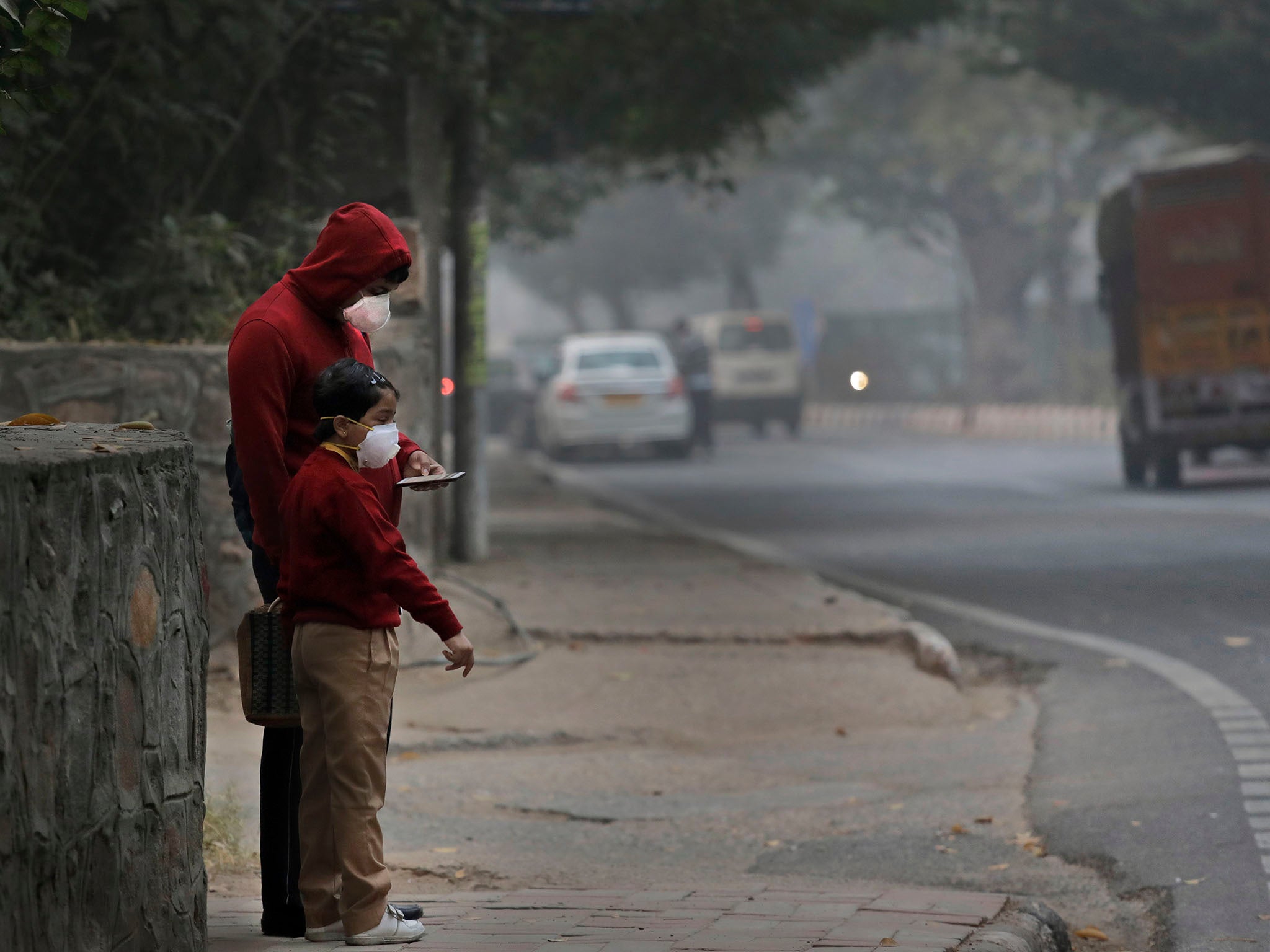 Many are forced to wear pollution masks to cope with the smog