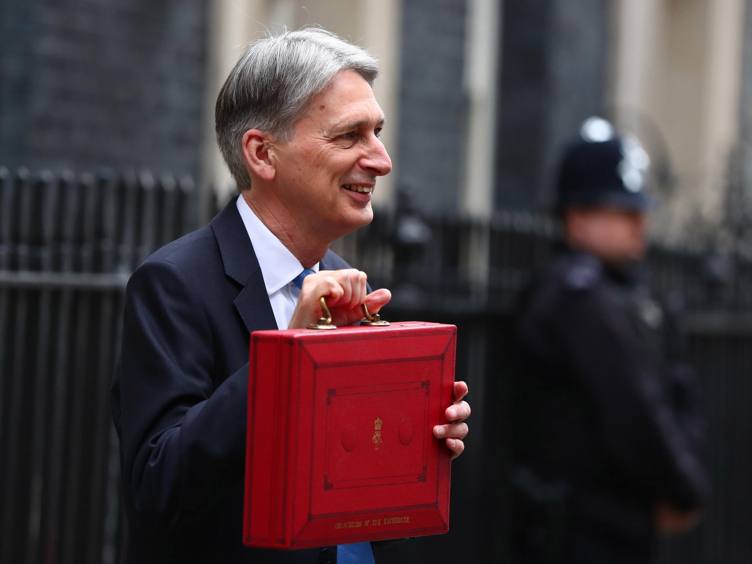 Britain's Chancellor of the Exchequer Phillip Hammond poses with the budget box at 11 Downing Street