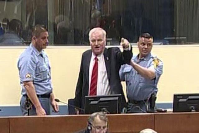 Bosnian Serb military chief Ratko Mladic shouts during an angry outburst in the Yugoslav War Crimes Tribunal in The Hague, Netherlands