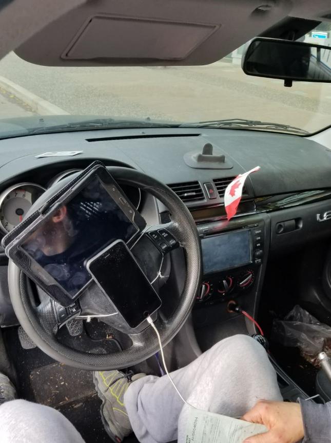 Traffic police fined a driver in Vancouver after he was found to have his phone and tablet strapped to his steering wheel.