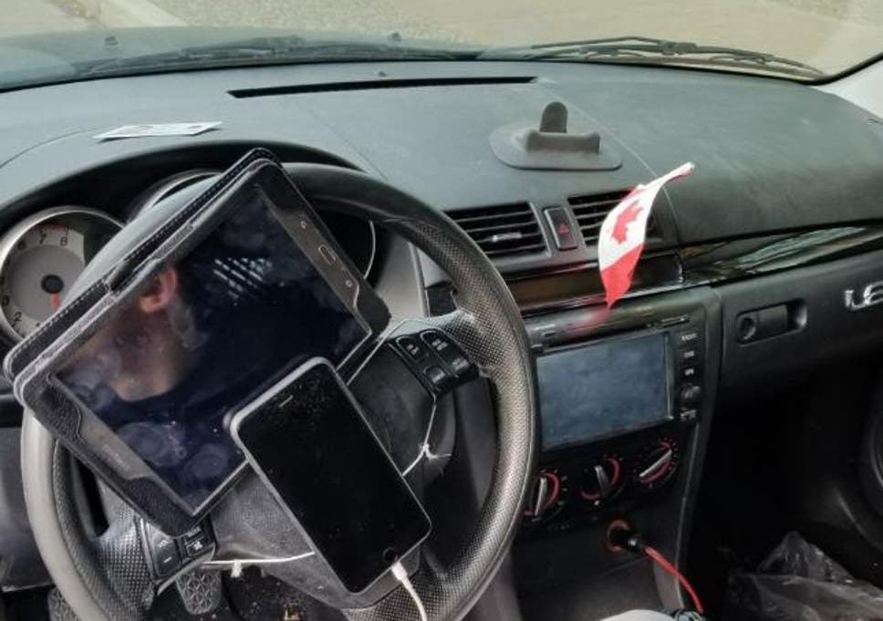 Traffic police fined a driver in Vancouver after he was found to have his phone and tablet strapped to his steering wheel.