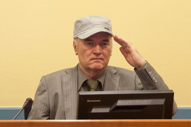 Ratko  Mladic salutes as he makes his first appearance at the International Criminal Tribunal in 2011 at The Hague, Netherlands