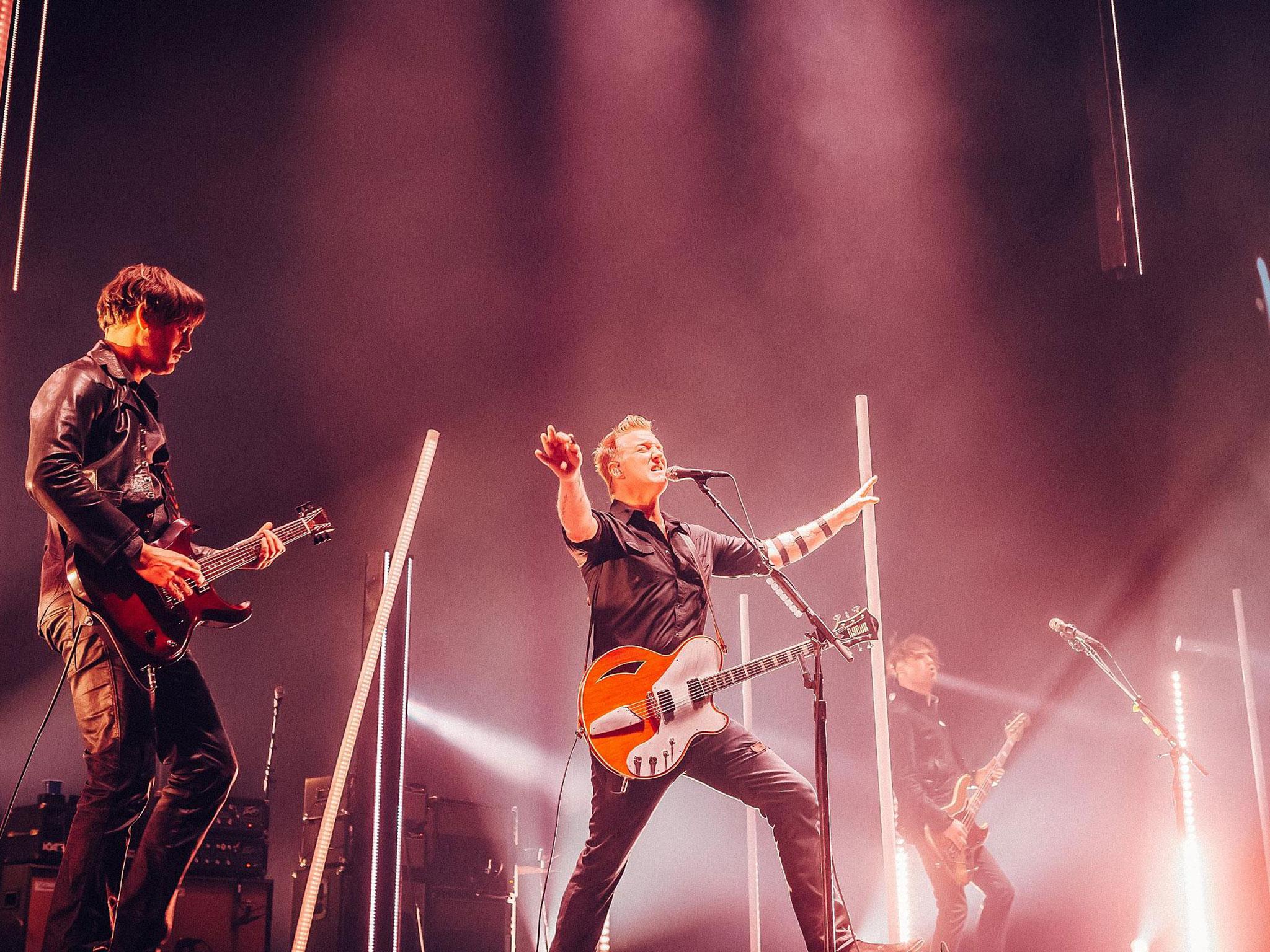 Queens of the Staone Age's Dean Fertita, Josh Homme and Michael Schuman at The O2 Arena