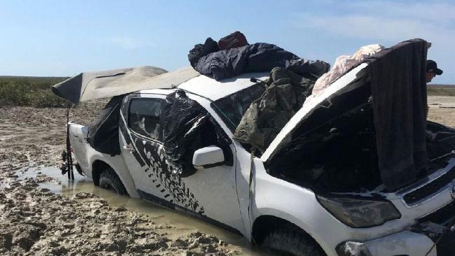 Two fishermen left stranded after their car became trapped in a bog on Friday