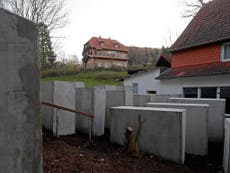 Protesters build Holocaust memorial near home of far-right politician