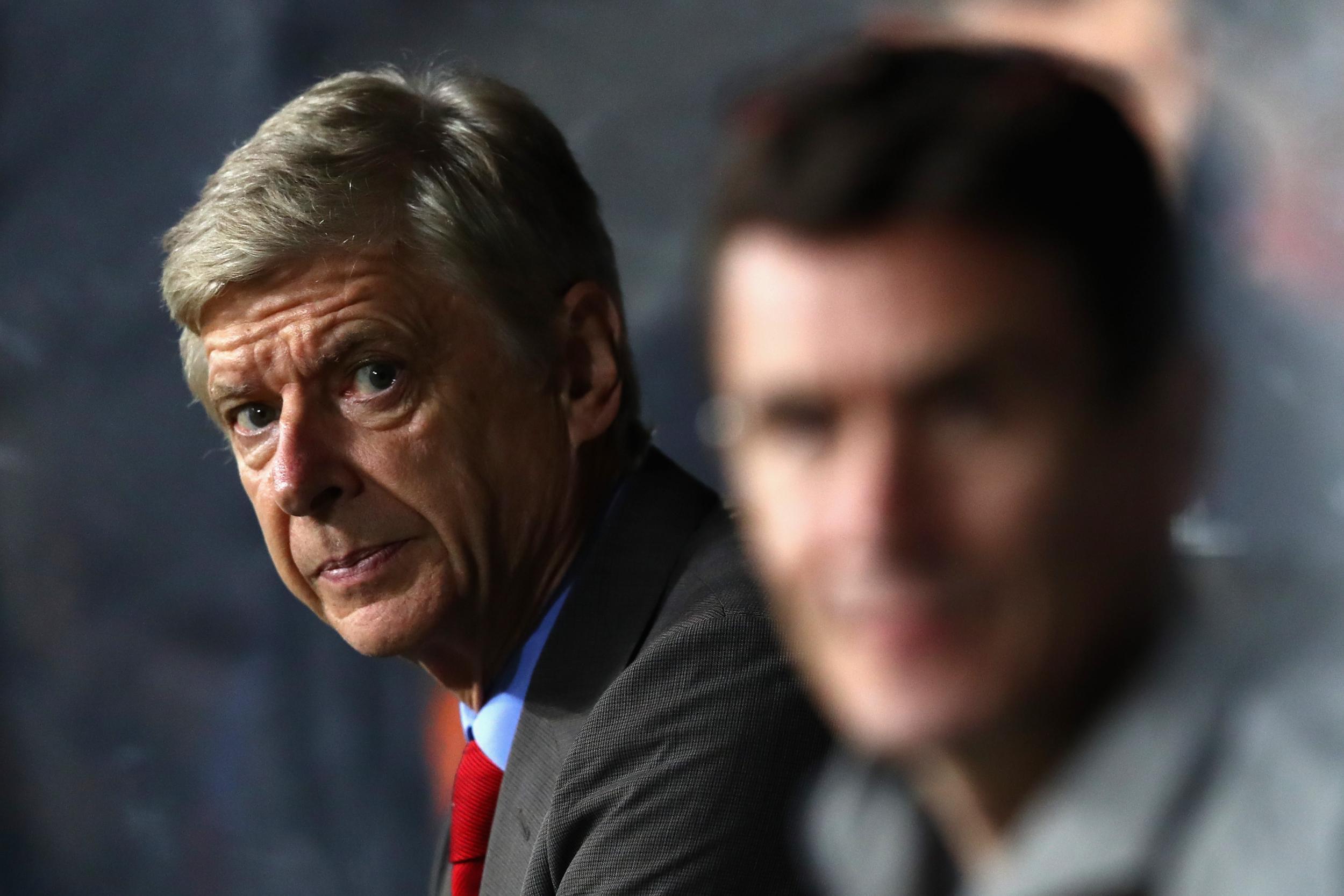 Arsene Wenger looks pensive in the dugout as Arsenal are beaten