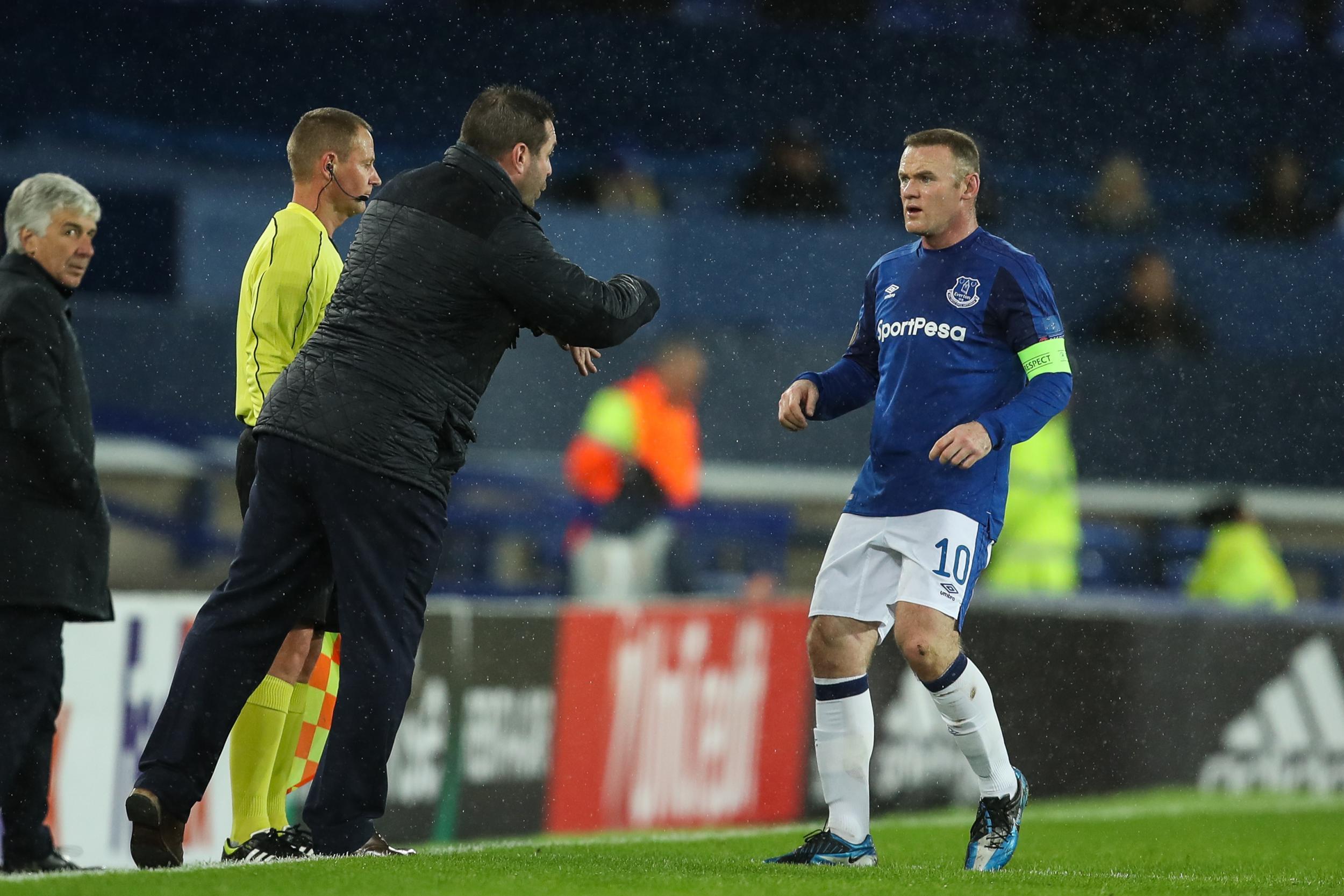 Wayne Rooney receives instructions from David Unsworth