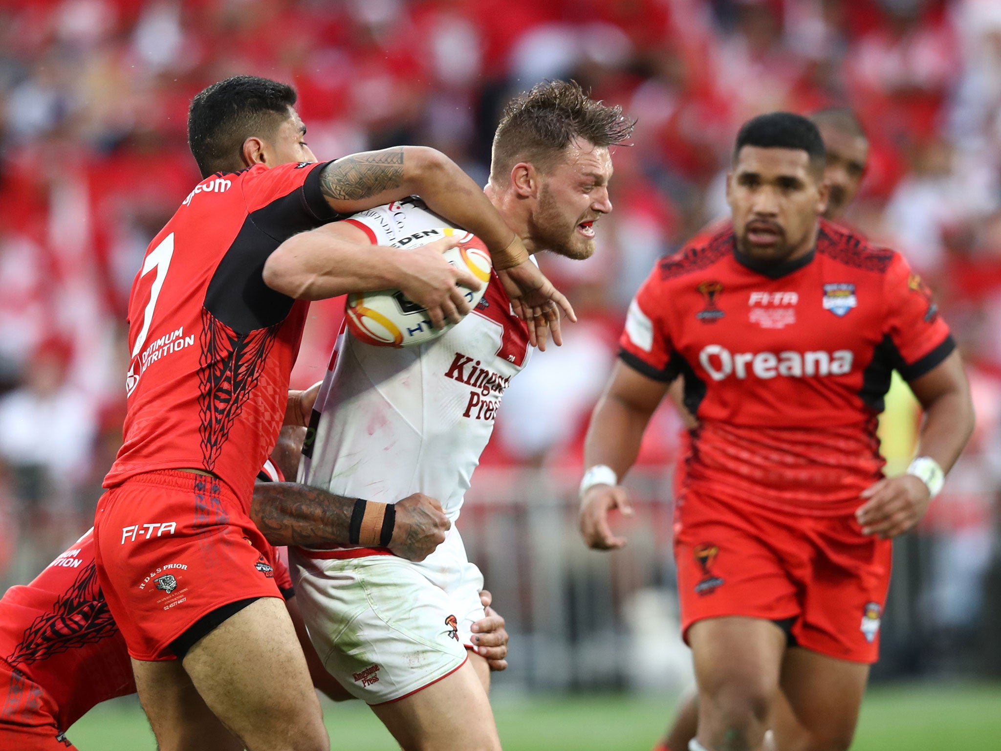 Elliott Whitehead is stopped in his tracks by the Tonga defence