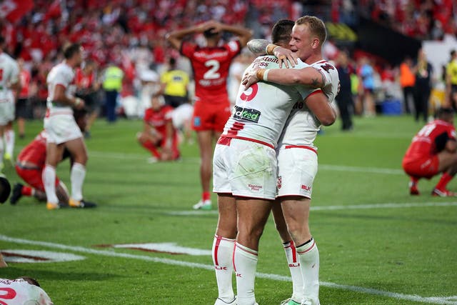 Ryan Hall (L) and Kevin Brown celebrate after the final whistle in Auckland