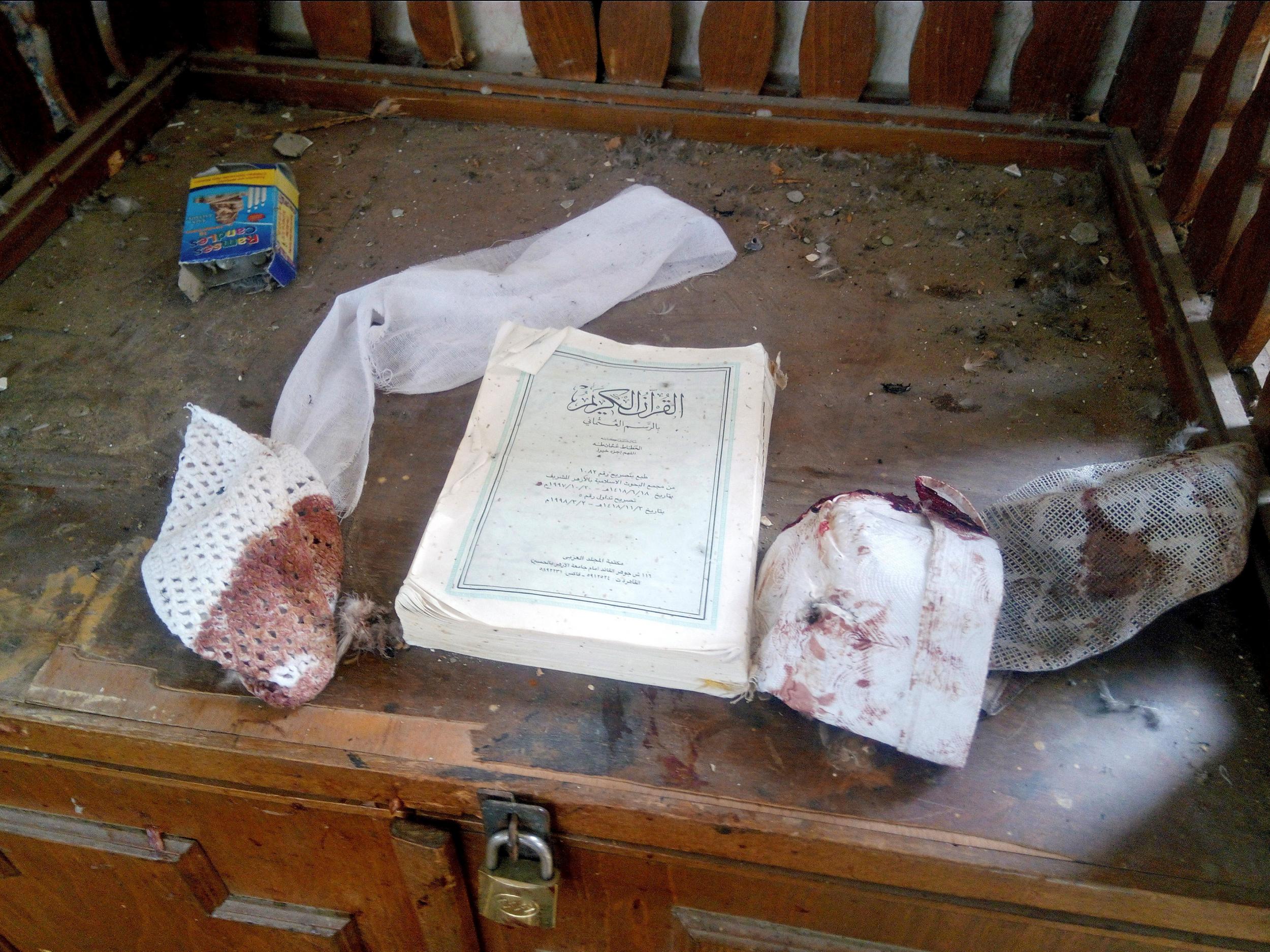 A Quran and remnants of personal belongings of victims of the attack on the al-Rawdah mosque