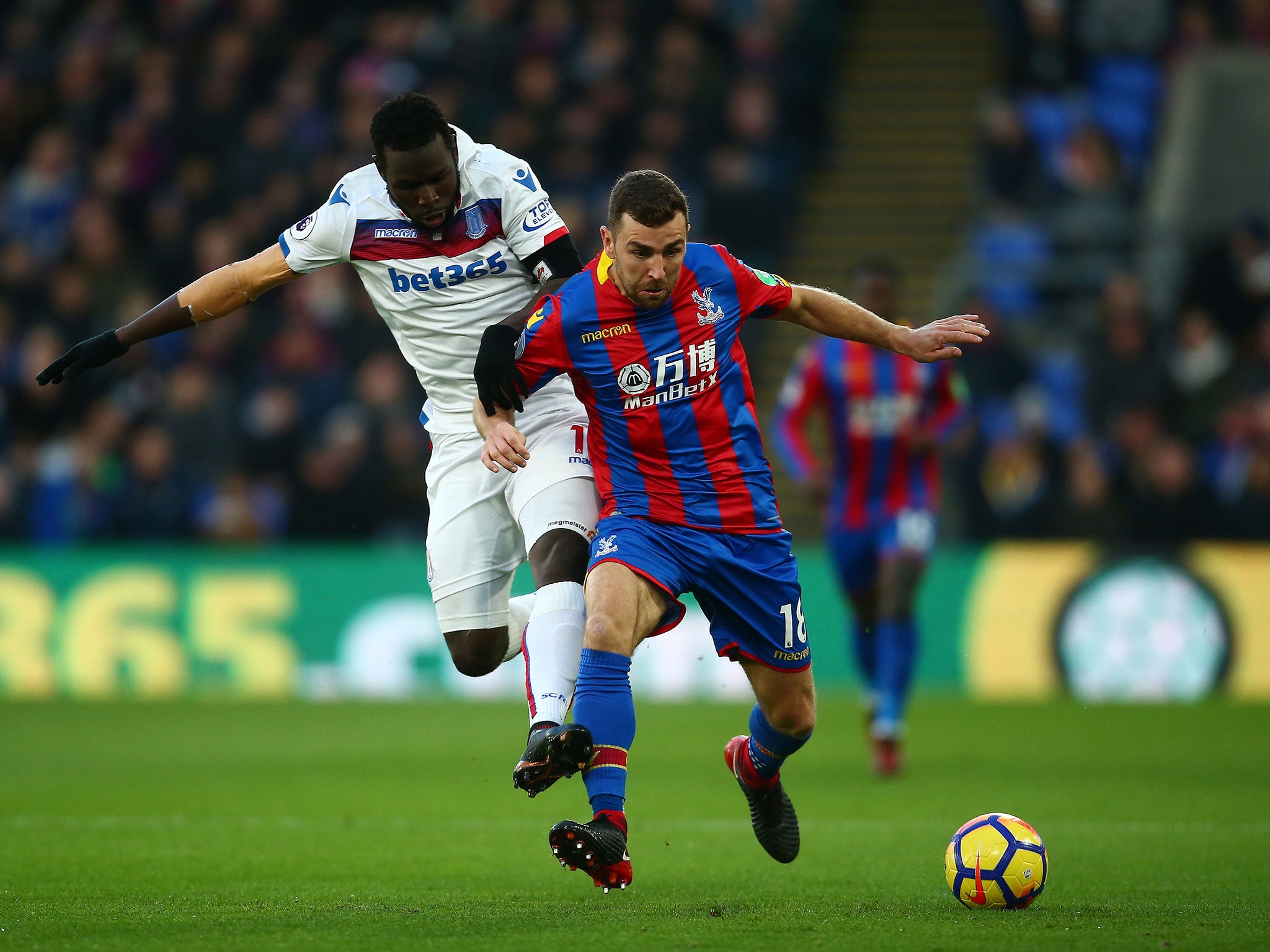 James McArthur and Mame Biram Diouf tussle for possession