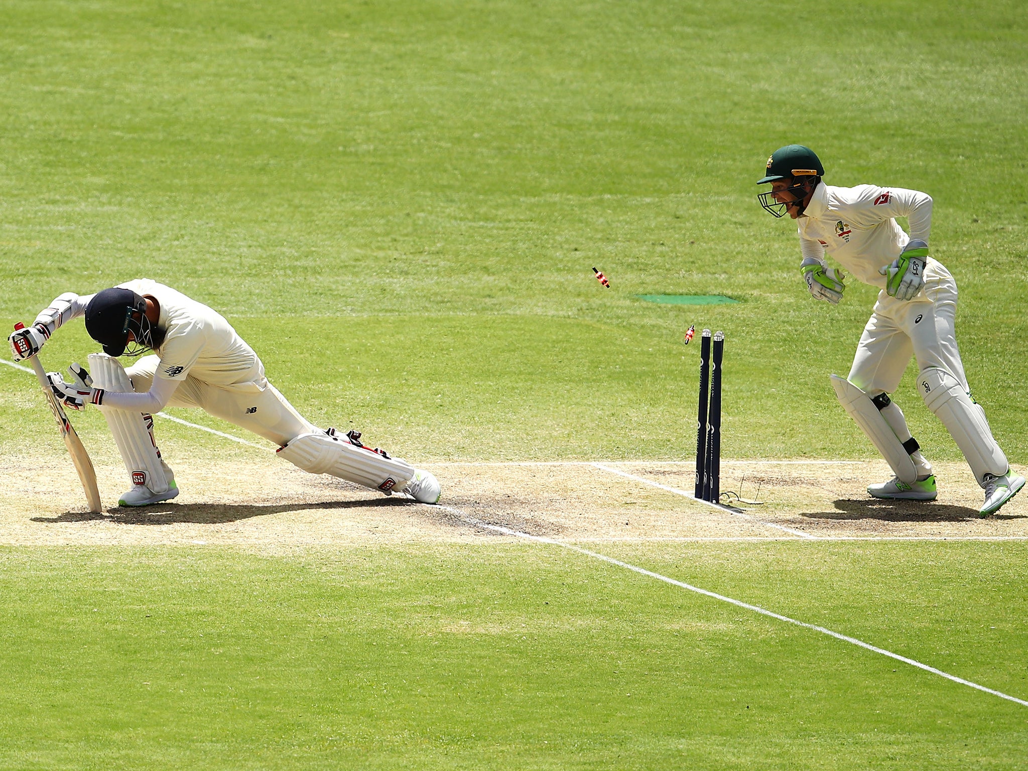 Moeen Ali is stumped by Tim Paine off Nathan Lyon's bowling