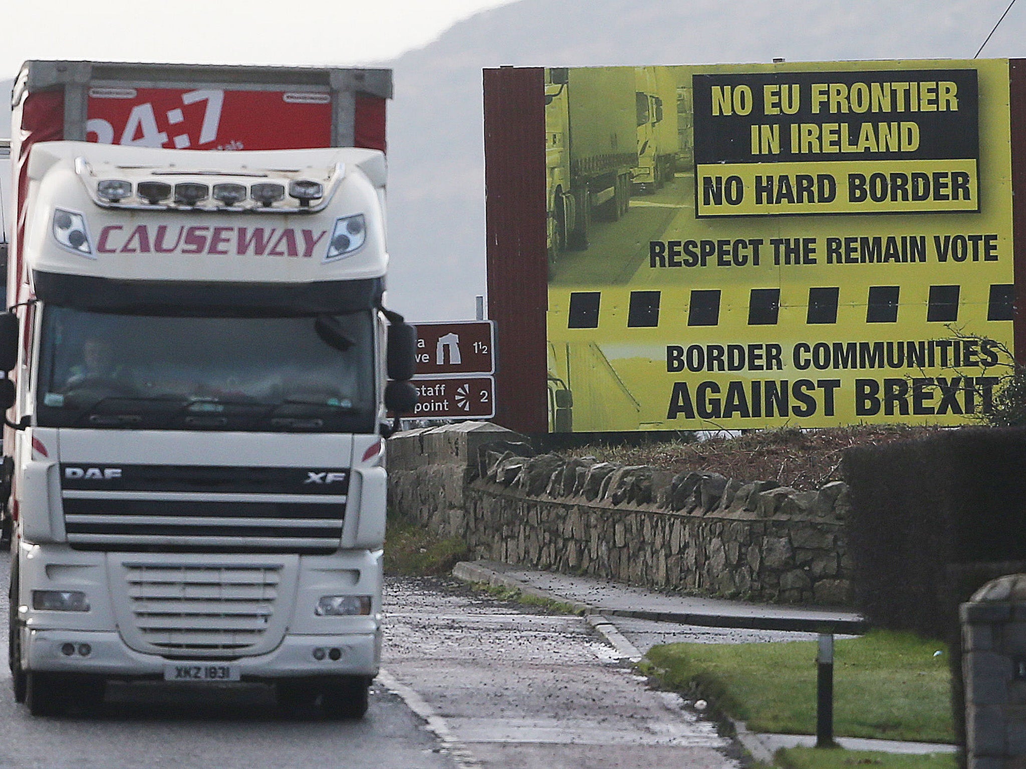 A truck passes a Brexit billboard in Jonesborough, Co Armagh, on the northern side of the border between Northern Ireland and the Republic of Ireland