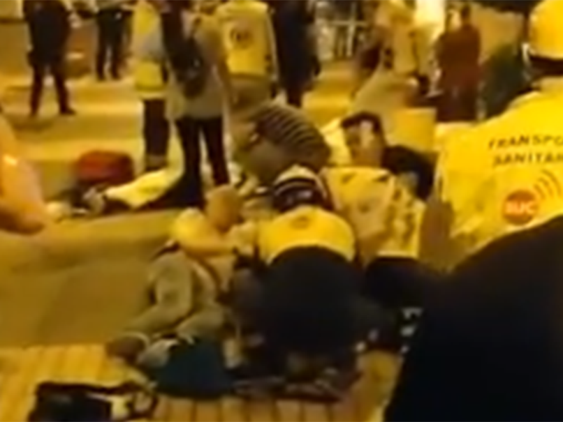 Paramedics attend to victims outside the Butterfly Disco Pub in the island of Tenerife in Spain
