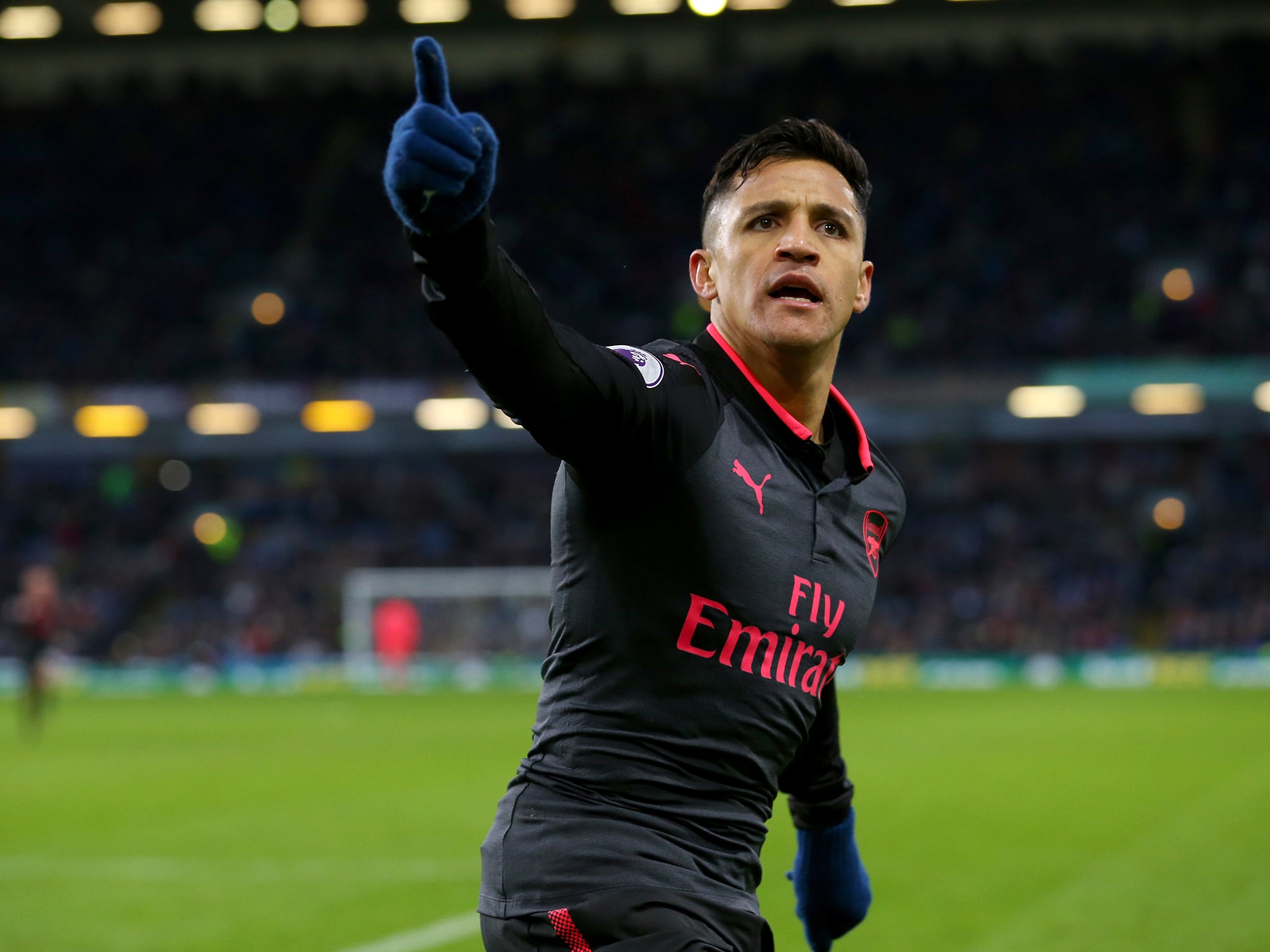Alexis Sanchez celebrates scoring a penalty to seal Arsenal's 1-0 injury-time victory over Burnley