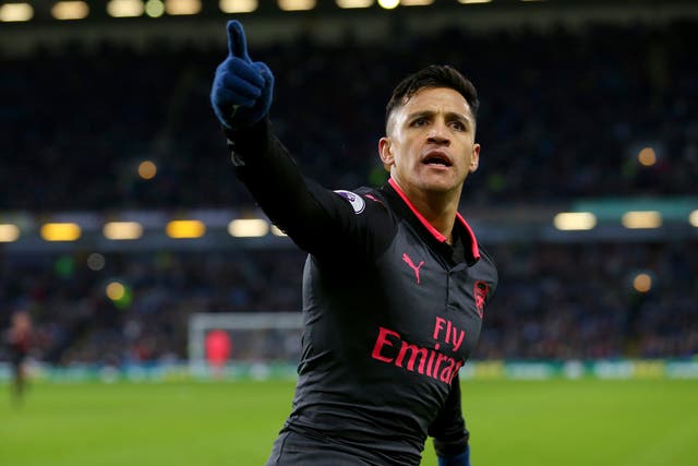 Alexis Sanchez celebrates scoring a penalty to seal Arsenal's 1-0 injury-time victory over Burnley