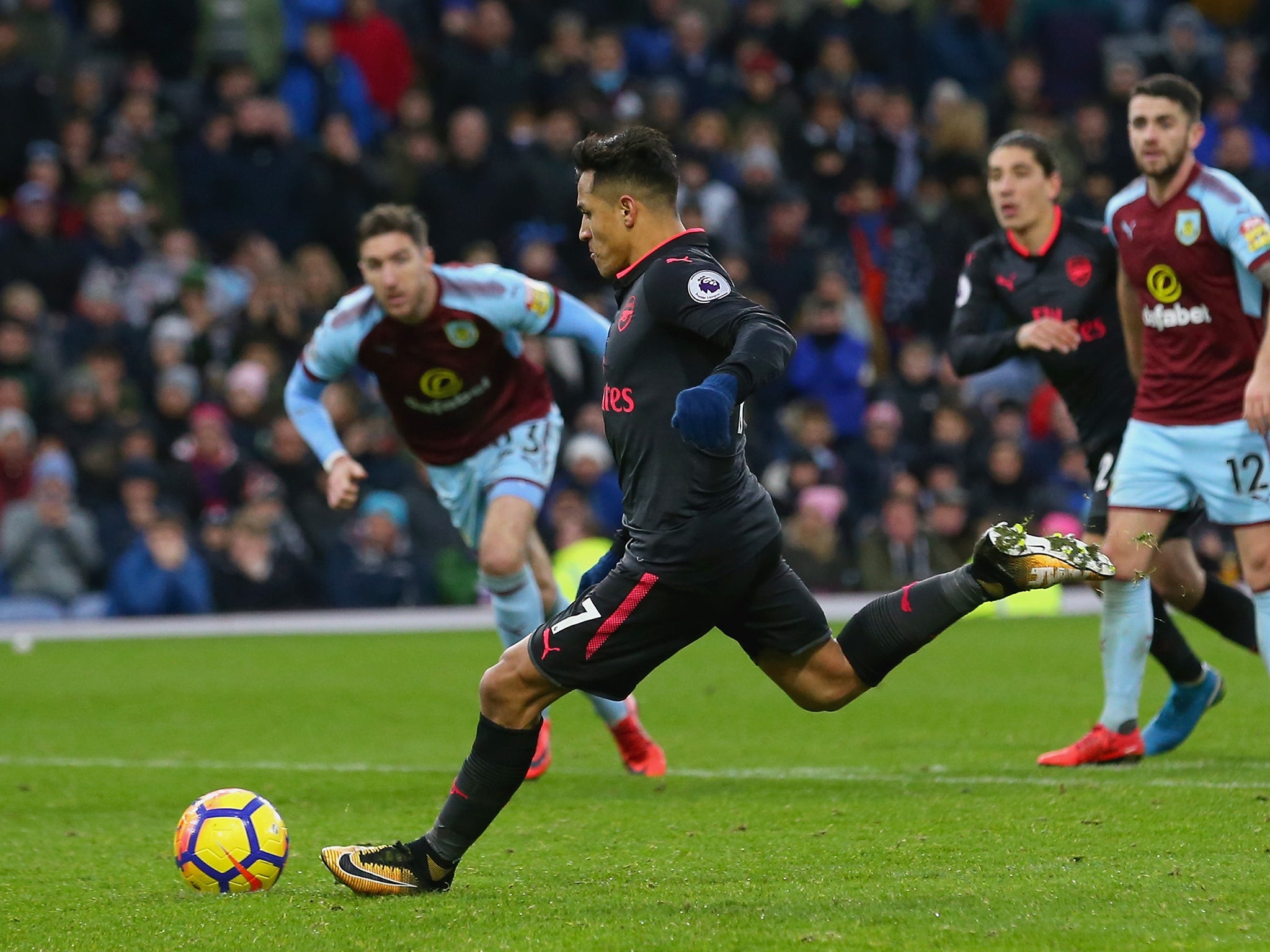 Alexis Sanchez scores from the penalty spot to seal victory for Arsenal