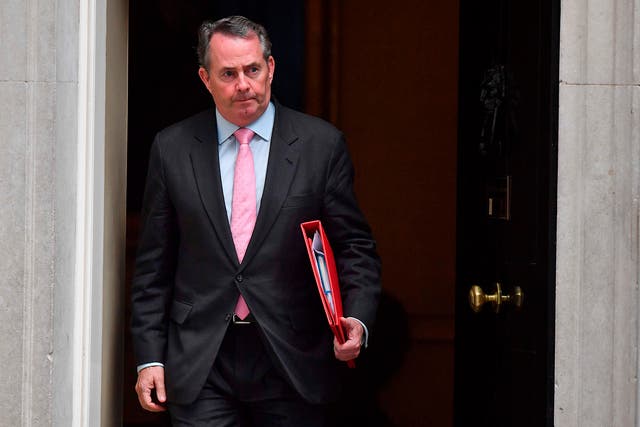 Britain's International Trade Secretary Liam Fox leaves 10 Downing Street